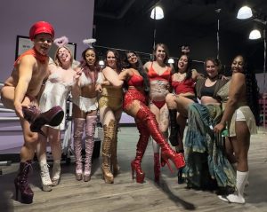 Pole Kisses Instructors and Students Pose for a Photo Together